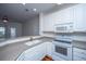 Bright kitchen featuring white cabinets, neutral countertops, a breakfast bar and stainless steel appliances at 1319 Basildon Rd, Mount Pleasant, SC 29466