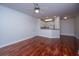 Open-concept living room and kitchen with hardwood floors and neutral wall color at 1319 Basildon Rd, Mount Pleasant, SC 29466