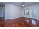 Open living room with hardwood floors, modern ceiling fan, and doors to outside at 1319 Basildon Rd, Mount Pleasant, SC 29466