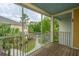 Screened-in patio with wooded view, railing, and wood floor at 1319 Basildon Rd, Mount Pleasant, SC 29466