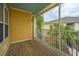 Screened-in patio with wood flooring and a view of the neighboring building at 1319 Basildon Rd, Mount Pleasant, SC 29466