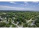 An elevated view of a neighborhood with mature trees, showing the proximity to industrial areas and the water at 1350 Mosstree Rd, North Charleston, SC 29405