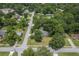 An aerial view of the home and surrounding neighborhood with mature trees and quiet streets at 1350 Mosstree Rd, North Charleston, SC 29405