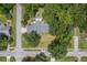 Aerial view of house with patio furniture surrounded by trees at 1350 Mosstree Rd, North Charleston, SC 29405