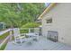 Charming back deck featuring classic rocking chairs and a convenient drink cooler, perfect for outdoor relaxation at 1350 Mosstree Rd, North Charleston, SC 29405