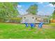 Inviting backyard patio area with comfortable seating around a fire pit, perfect for outdoor entertaining at 1350 Mosstree Rd, North Charleston, SC 29405