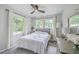 Bright bedroom filled with natural light from dual windows and minimalist decor at 1350 Mosstree Rd, North Charleston, SC 29405