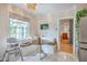 Cozy breakfast nook features built in bench seating and lots of natural light at 1350 Mosstree Rd, North Charleston, SC 29405