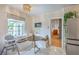 Inviting breakfast nook features built-in bench seating, and a view to the back yard at 1350 Mosstree Rd, North Charleston, SC 29405