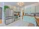 Charming kitchen boasts stainless steel appliances, wood counters and white tile floors at 1350 Mosstree Rd, North Charleston, SC 29405