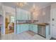 Bright kitchen showcases wood countertops, stainless steel appliances and beadboard trim at 1350 Mosstree Rd, North Charleston, SC 29405