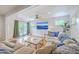 Bright living room has hardwood floors, comfortable seating and lots of natural light at 1350 Mosstree Rd, North Charleston, SC 29405