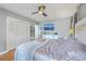 Comfortable bedroom featuring a ceiling fan, television, and ample closet space at 1350 Mosstree Rd, North Charleston, SC 29405