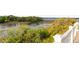 Marsh view from balcony featuring lush greenery, serene waters, and a refreshing outdoor experience at 158 Mary Ellen Dr, Charleston, SC 29403