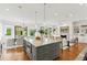 A large kitchen island with marble top provides ample seating and storage in this open-concept living space at 158 Mary Ellen Dr, Charleston, SC 29403