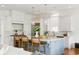 Spacious white kitchen with a blue island, stainless steel appliances, and pendant lighting at 158 Mary Ellen Dr, Charleston, SC 29403