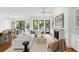 Bright open-concept living room boasts a fireplace, white sofa, and access to an outdoor patio at 158 Mary Ellen Dr, Charleston, SC 29403