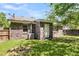 Brick home exterior featuring a well-maintained lawn and fenced yard at 202 Pamela Ln, Summerville, SC 29483