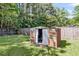 Backyard shed with open door and grassy surrounding at 202 Pamela Ln, Summerville, SC 29483