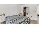 Minimalist bedroom with black-and-white bedding, light walls, and closet space for a clean, restful retreat at 202 Pamela Ln, Summerville, SC 29483