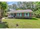 Charming single story brick home with a well manicured lawn and blue shutters at 202 Pamela Ln, Summerville, SC 29483