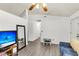 Bright living room with sleek floors, minimalist decor, and modern ceiling fan at 202 Pamela Ln, Summerville, SC 29483