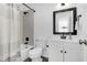 This bathroom features dark wood-style floors, a vanity with a black faucet, and a shower-tub combination at 202 Waterwood Dr, Goose Creek, SC 29445