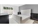 This bedroom features a gray accent wall, a large window with a sliding glass door, and black nightstands at 202 Waterwood Dr, Goose Creek, SC 29445