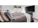 This bedroom features a large window with a sliding glass door, a brown bed, and a large TV at 202 Waterwood Dr, Goose Creek, SC 29445