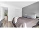 This bedroom features a gray accent wall, a closet, and a doorway leading to another room at 202 Waterwood Dr, Goose Creek, SC 29445