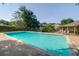 Large community pool with lounging chairs and bathroom area at 202 Waterwood Dr, Goose Creek, SC 29445