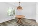 Dining area featuring natural light and a unique pendant light fixture above a table at 202 Waterwood Dr, Goose Creek, SC 29445