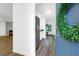 Open entryway with kitchen and living room views featuring sleek flooring at 202 Waterwood Dr, Goose Creek, SC 29445