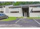 Exterior of condo with assigned parking and steps leading to the front door at 202 Waterwood Dr, Goose Creek, SC 29445