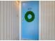 Bright blue front door with decorative wreath and unit number 202 at 202 Waterwood Dr, Goose Creek, SC 29445