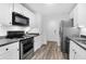 Modern kitchen with stainless steel appliances, white cabinets and updated appliances at 202 Waterwood Dr, Goose Creek, SC 29445