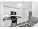 Bright kitchen features white cabinetry, stainless steel appliances, and a double bowl sink at 202 Waterwood Dr, Goose Creek, SC 29445