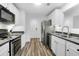Bright and modern kitchen with stainless steel appliances and neutral finishes at 202 Waterwood Dr, Goose Creek, SC 29445