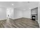Spacious living room with hardwood flooring and a cozy fireplace, perfect for relaxation at 202 Waterwood Dr, Goose Creek, SC 29445