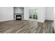 Bright living room featuring a fireplace and sliding glass doors leading to an outdoor patio at 202 Waterwood Dr, Goose Creek, SC 29445
