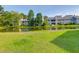 Green lawn and idyllic pond surrounded by Greenslake condos at 202 Waterwood Dr, Goose Creek, SC 29445