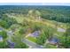 Aerial view of a charming neighborhood with views of a nearby golf course at 204 Bellerive Ln, Summerville, SC 29483