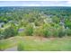 Residential neighborhood nestled in dense woodlands, featuring winding streets, golf courses, and a mix of house styles at 204 Bellerive Ln, Summerville, SC 29483