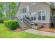 Enjoy the backyard with deck access, lush lawn, and mature trees, perfect for outdoor living at 204 Bellerive Ln, Summerville, SC 29483