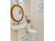 Elegant powder room with a pedestal sink, decorative mirror, and classic fixtures at 204 Bellerive Ln, Summerville, SC 29483