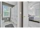 Bright bathroom featuring a shower with a curtain, a window, and a toilet at 204 Bellerive Ln, Summerville, SC 29483