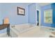 A light blue bathroom boasts a large jacuzzi tub, and a window at 204 Bellerive Ln, Summerville, SC 29483