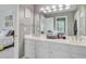 Bathroom featuring dual sinks, white cabinetry, a large mirror, and ample counter space at 204 Bellerive Ln, Summerville, SC 29483