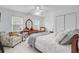 Bright bedroom with natural light, ceiling fan, and a cozy armchair, creating a relaxing retreat at 204 Bellerive Ln, Summerville, SC 29483