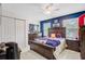 Cozy bedroom with neutral carpet, ceiling fan, and a wooden sleigh bed with dark wood furniture at 204 Bellerive Ln, Summerville, SC 29483